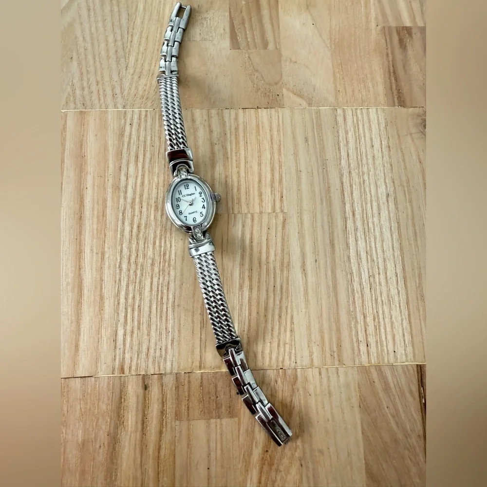 CC Hughes ladies oval silver tone watch NEW BATTERY